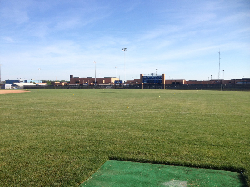 Problem: Outfield did not have positive surface drainage. Field held water and hindered play.